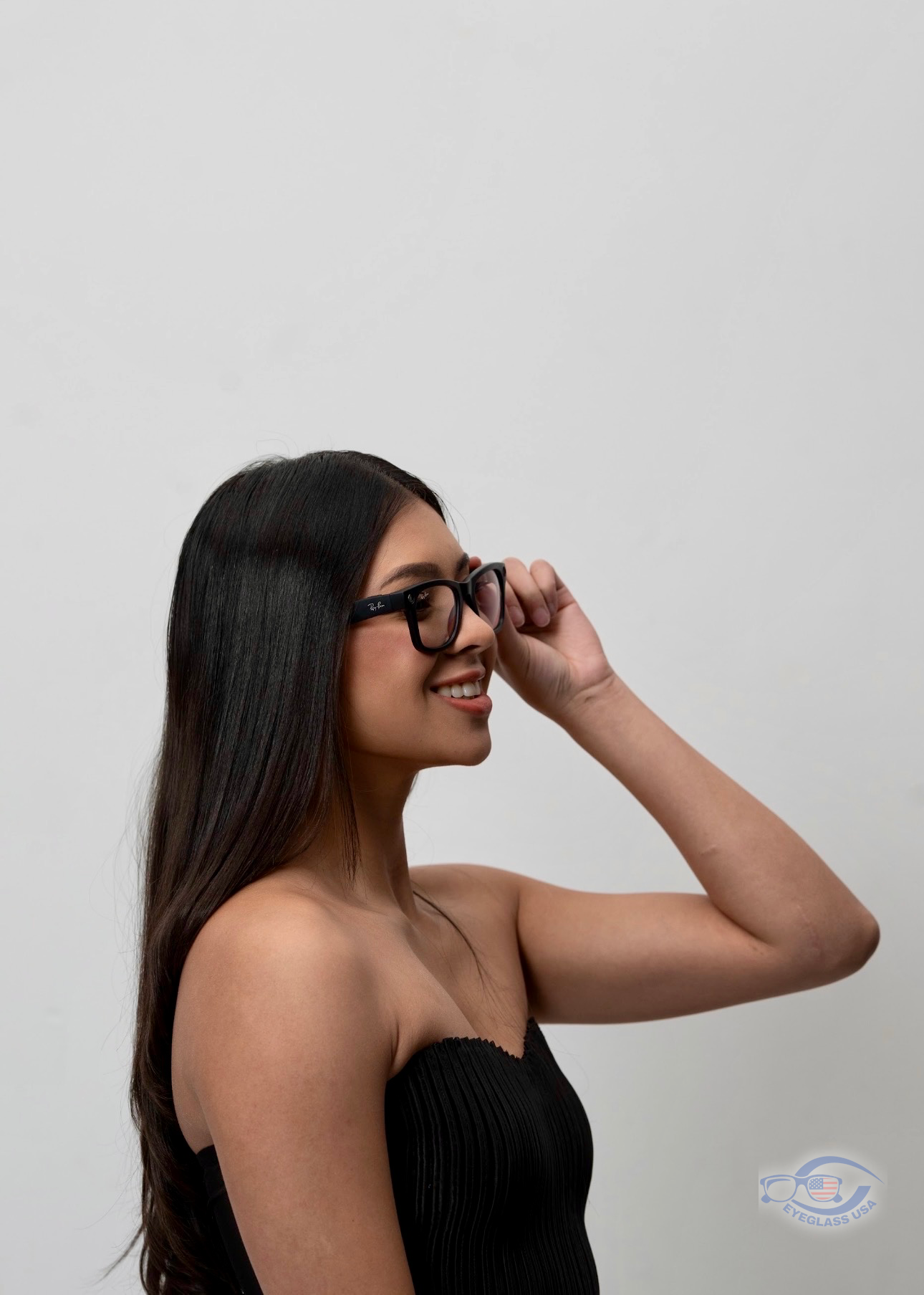 Smiling customer wearing Ray-Ban prescription glasses