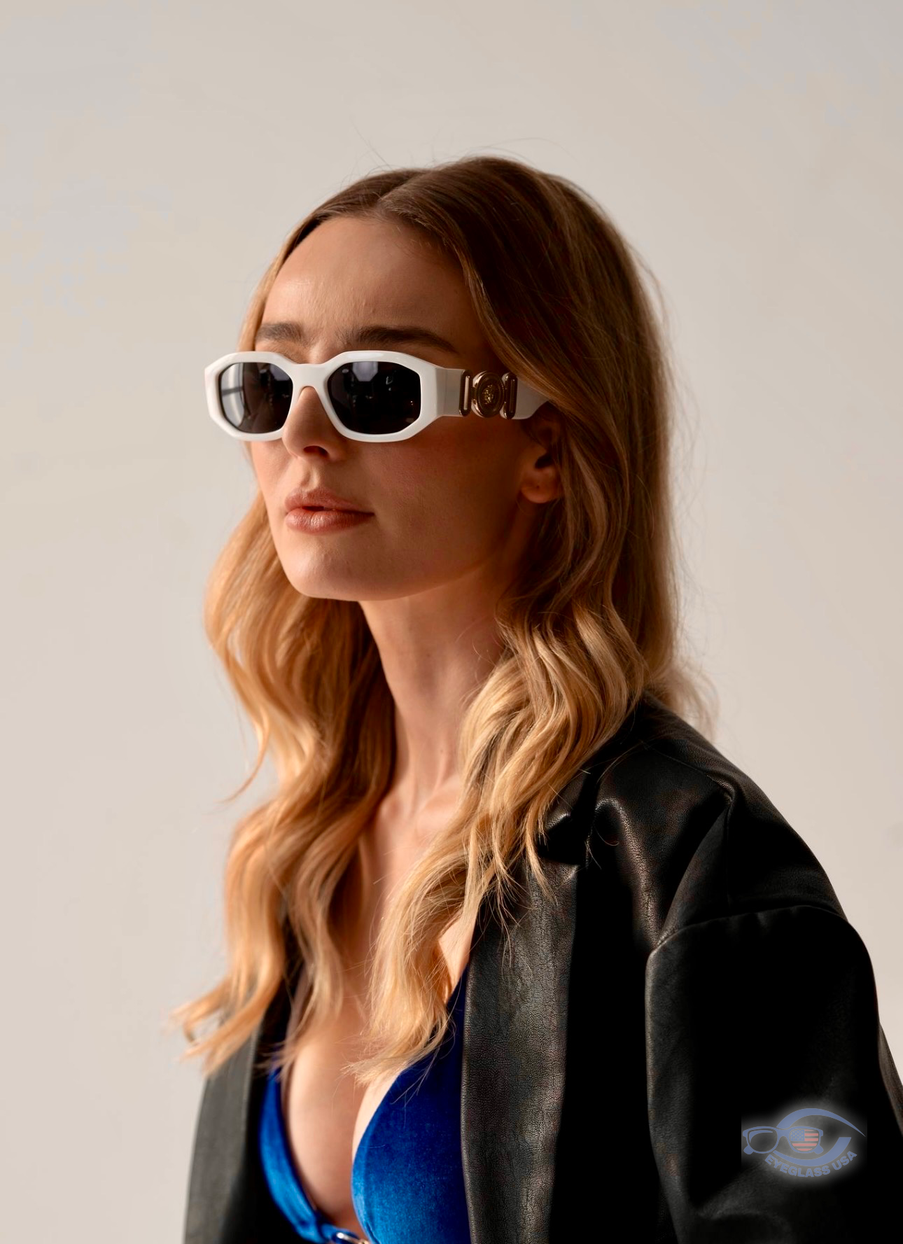 Customer in white Versace sunglasses and black leather jacket